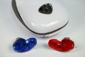 blue and red hearing aids with white and black case