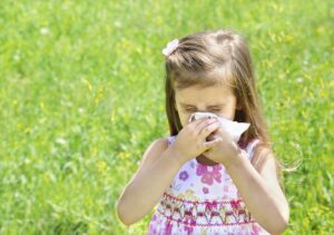 girl blowing nose