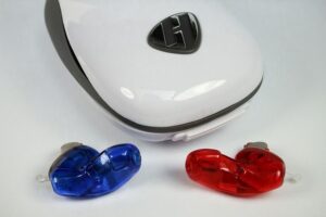 blue and red hearing aids with case